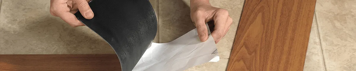 A professional installing vinyl flooring in Long Beach, CA